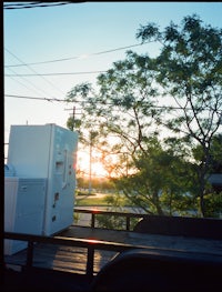 a white refrigerator sitting on the back of a truck